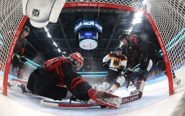 <p>2022 Beijing Olympics - Ice Hockey - Men's Prelim. Round - Group A - Canada v Germany - Wukesong Sports Centre, Beijing, China - February 10, 2022. Eddie Pasquale of Canada and Jason Demers of Canada in action with David Wolf of Germany. Pool via REUTERS/Song Yanhua</p>