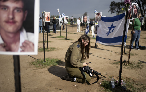 <p>An Israeli soldier weeps at the marker for a loved one kidnapped on Oct. 7 in a cross-border attack by Hamas at the Nova music festival, after a press conference at the site in Re'im, southern Israel, Friday, Jan. 5, 2024. (AP Photo/Maya Alleruzzo)</p>